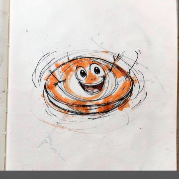 Whizz, a spinning orange disc with a big grin